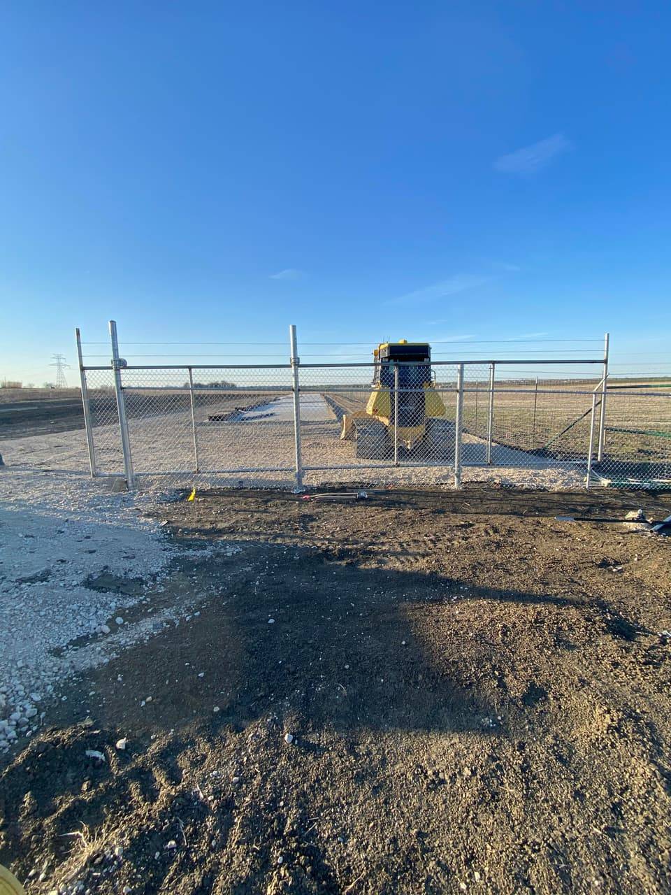 Commercial Fencing example — Temporary chain-link security fencing at an active job site, Central Texas commercial site