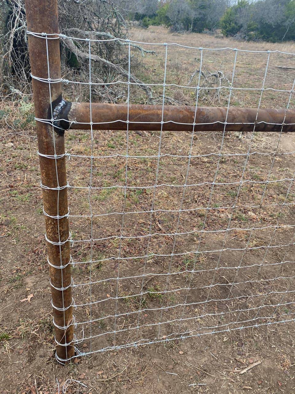 Wire Panel Fencing example — Welded wire fence panel secured to a steel pipe post, Central Texas ranch